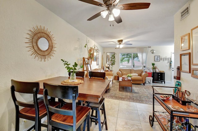 dining room featuring light tile patterned floors and ceiling fan