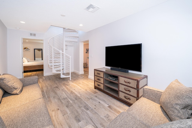 living room with light hardwood / wood-style floors