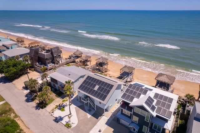 bird's eye view featuring a beach view and a water view