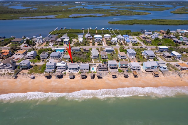 aerial view with a beach view and a water view