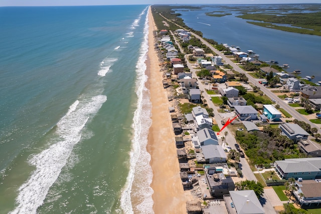 aerial view featuring a beach view and a water view