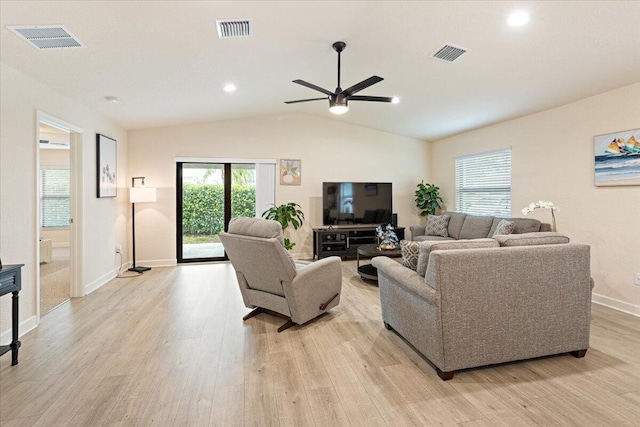 living room with vaulted ceiling, light hardwood / wood-style flooring, and ceiling fan