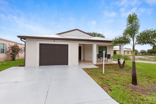 ranch-style home with a porch, a garage, and a front lawn