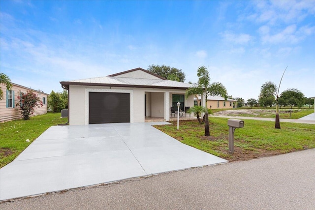 ranch-style home with a porch, a front yard, and a garage