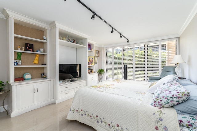 bedroom featuring ornamental molding, light tile floors, and rail lighting