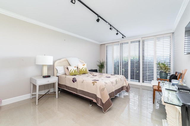 tiled bedroom featuring crown molding and rail lighting