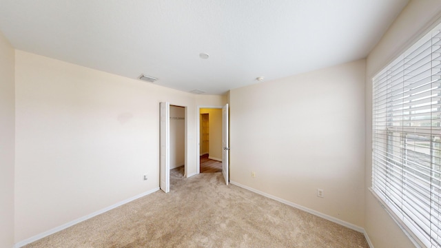 empty room with light colored carpet