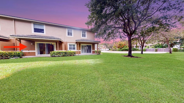 view of front of home with a yard