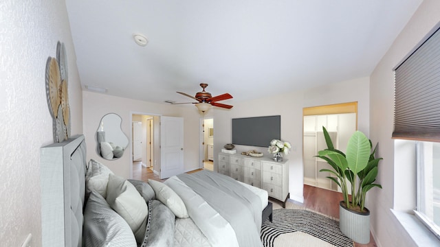 bedroom with ceiling fan and light wood-type flooring