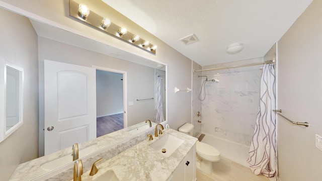 bathroom with curtained shower, a textured ceiling, vanity, toilet, and hardwood / wood-style flooring