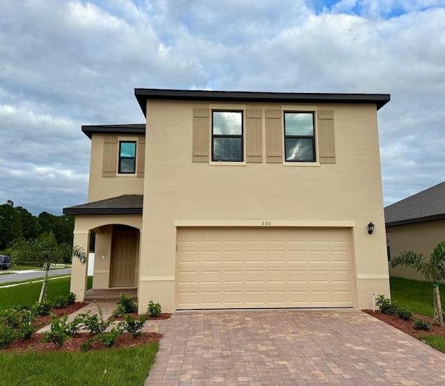 view of front of property featuring a garage