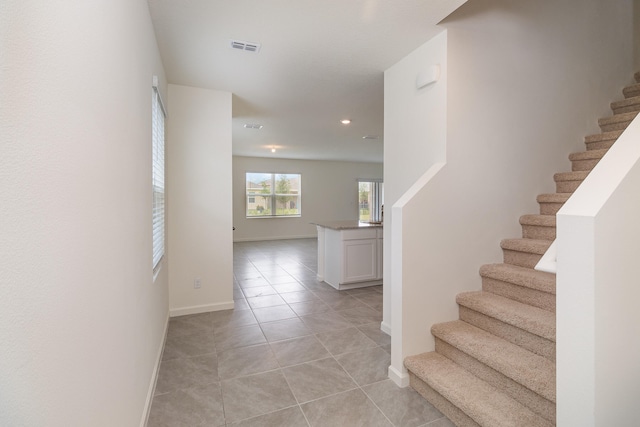 staircase with tile patterned flooring