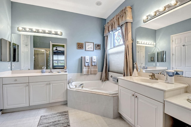 bathroom with shower with separate bathtub, vanity, and tile patterned floors