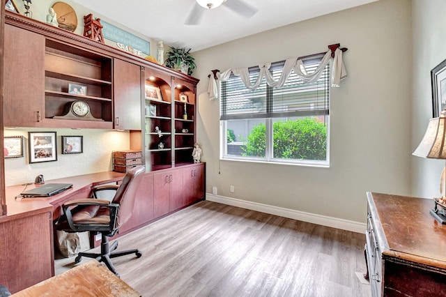 office area with ceiling fan, light hardwood / wood-style floors, and a wealth of natural light