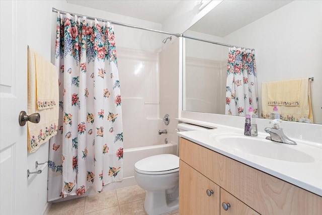 full bathroom with tile patterned flooring, vanity, shower / tub combo, and toilet