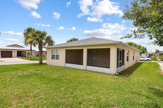 rear view of property with a lawn