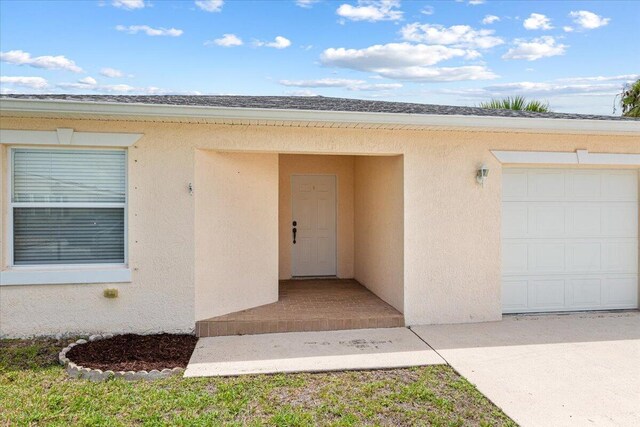 entrance to property featuring a garage