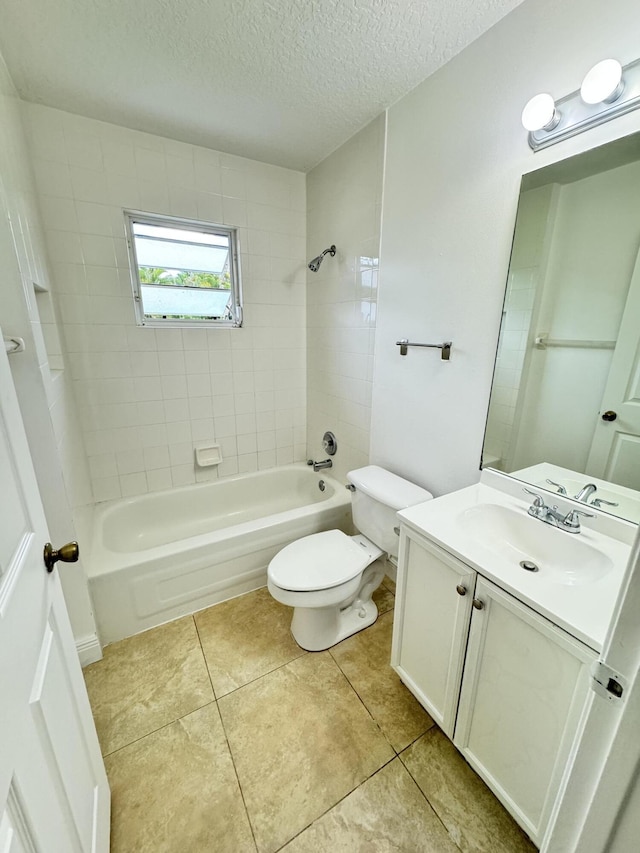 full bathroom with toilet, a textured ceiling, tile patterned flooring, tiled shower / bath combo, and vanity