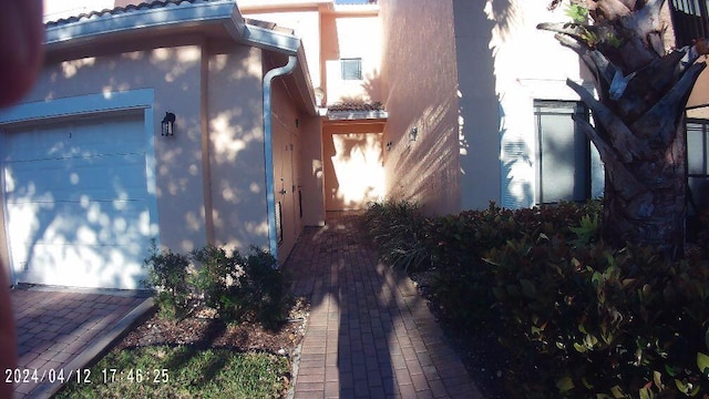 view of property exterior featuring a garage