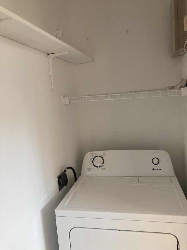 laundry room featuring washer / clothes dryer and electric panel