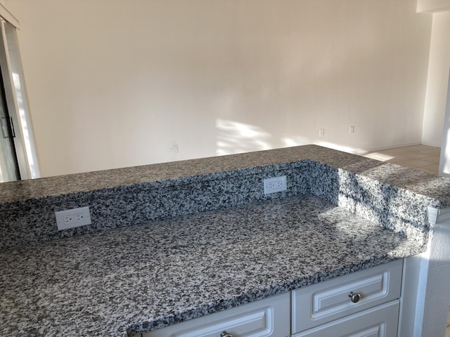 interior details featuring white cabinets