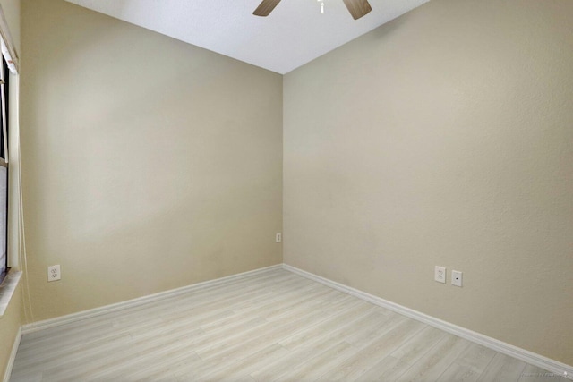 unfurnished room featuring light wood-type flooring and ceiling fan