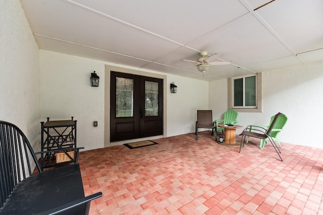 entrance to property with french doors and ceiling fan