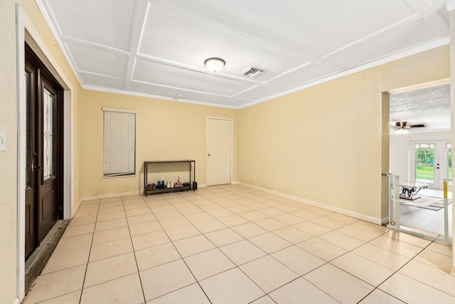 unfurnished living room featuring ceiling fan, light tile patterned flooring, and a textured ceiling