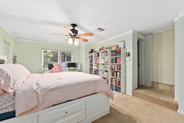 bedroom with light carpet, ceiling fan, and crown molding