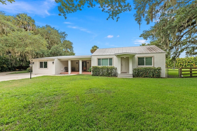 ranch-style house with a front lawn