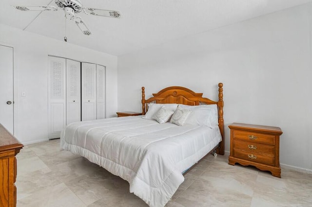 bedroom featuring ceiling fan and a closet