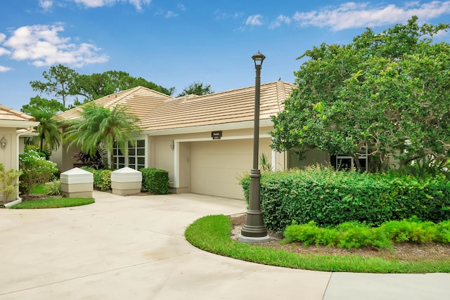 ranch-style house featuring a garage