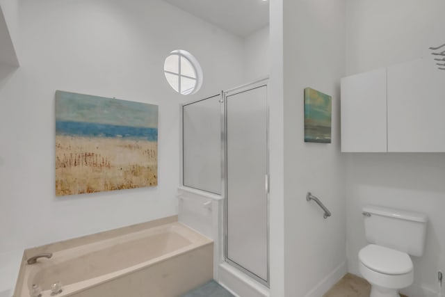 bathroom with separate shower and tub and toilet