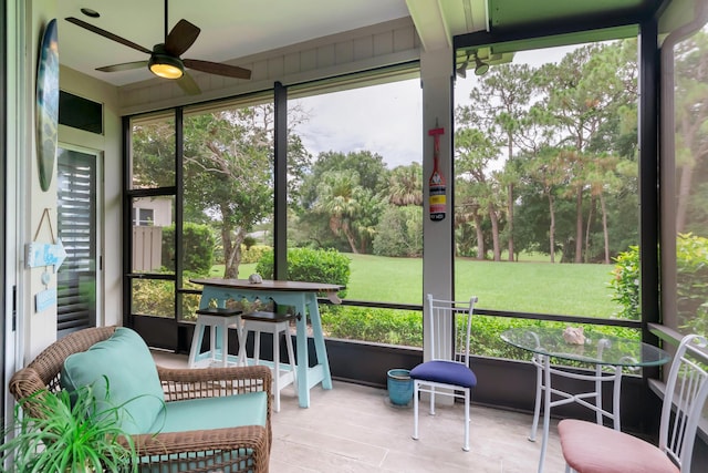 sunroom / solarium with ceiling fan