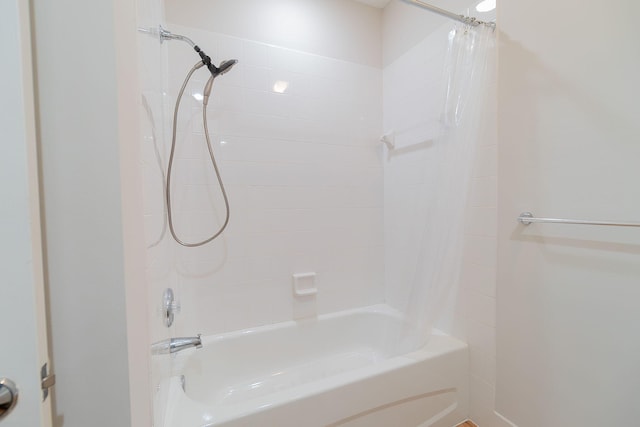 bathroom featuring shower / bath combo with shower curtain