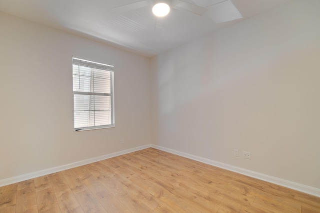 spare room with light hardwood / wood-style flooring and ceiling fan