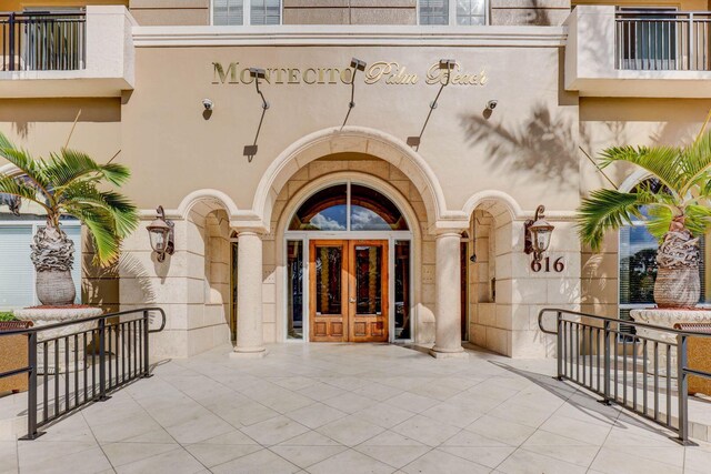 property entrance featuring french doors