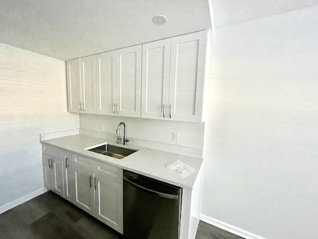 kitchen with dishwasher, white cabinets, and sink