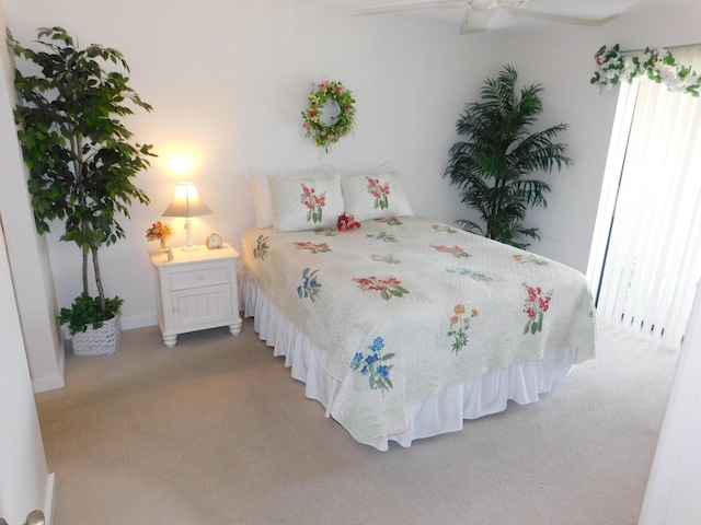 bedroom with ceiling fan and carpet flooring