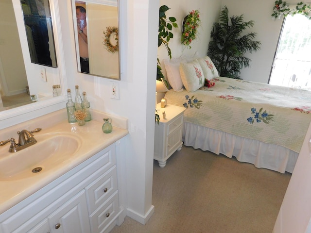 carpeted bedroom featuring sink