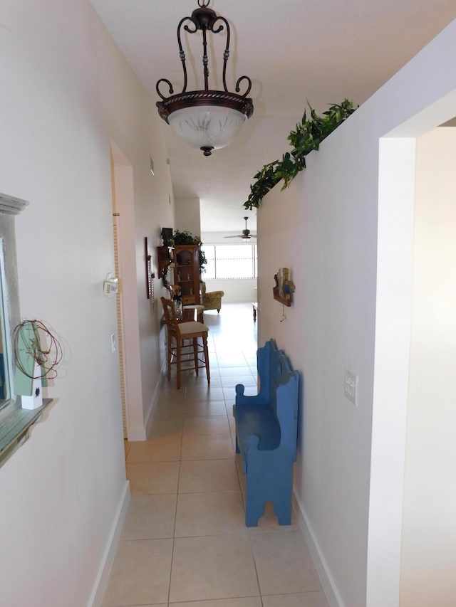 hallway featuring light tile patterned flooring