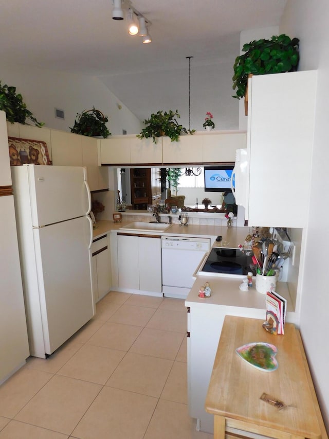 kitchen featuring high vaulted ceiling, sink, white appliances, and light tile patterned flooring