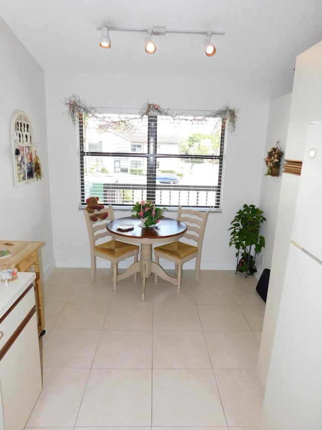 dining area with light tile patterned floors