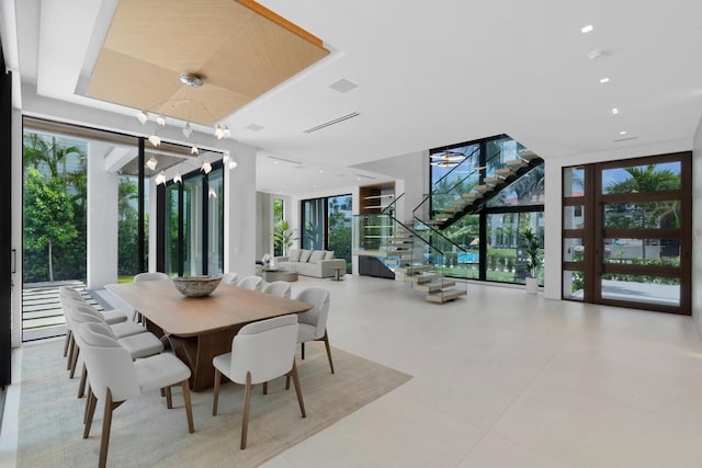 dining space featuring floor to ceiling windows