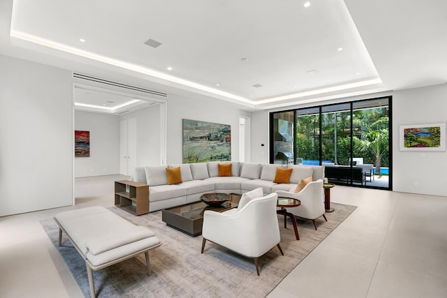 living room featuring a tray ceiling