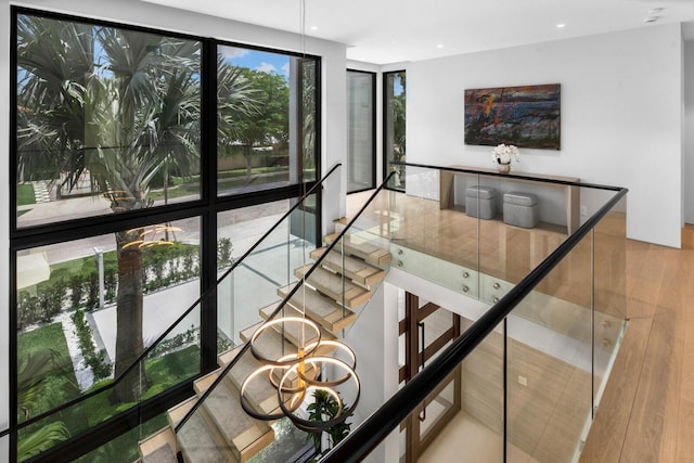 stairs with hardwood / wood-style floors