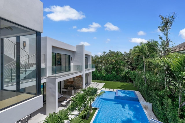 view of swimming pool with a patio area and a lawn