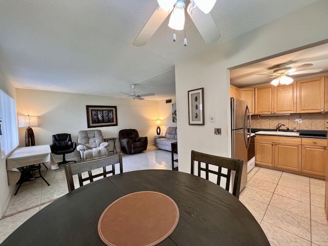 dining space with a ceiling fan