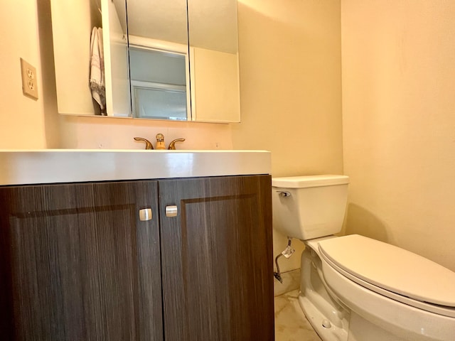 bathroom with tile patterned floors, toilet, and vanity