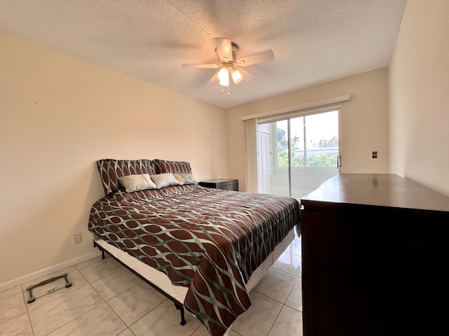 bedroom featuring light tile patterned floors, baseboards, access to outside, and a ceiling fan